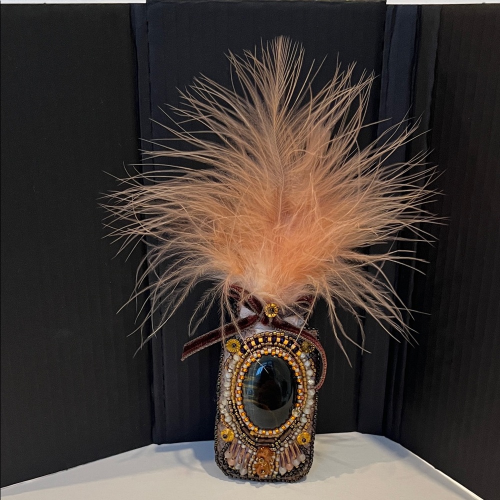 Beaded Tiger Eye cabochon brooch with fearhers and vintage velvet ribbon.
